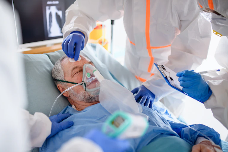Image of an infected patient in quarantine lying in bed in hospital.