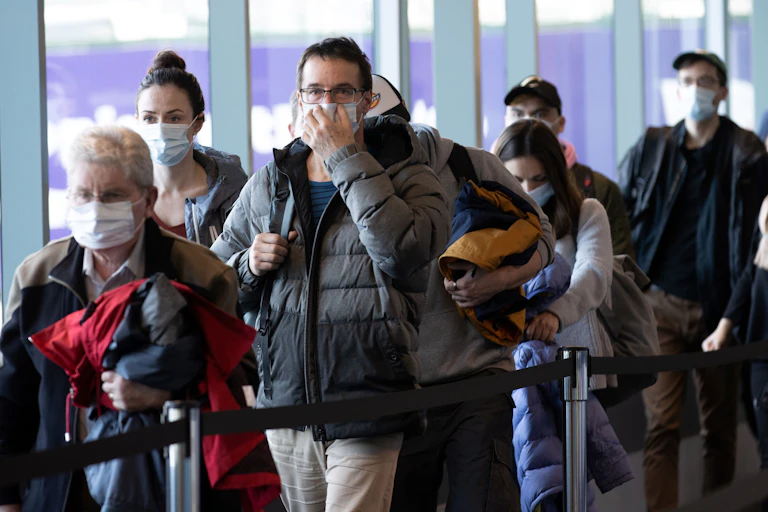 Airport passengers in masks