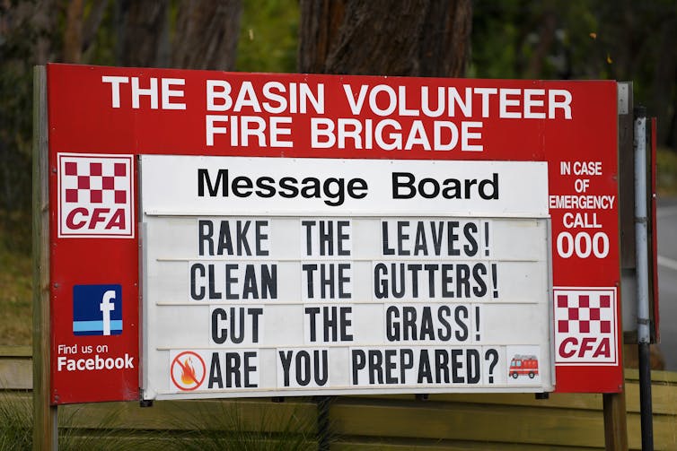 A fire station noticeboard that reads 'rake the leaves, clean the gutters, cut the grass, are you prepared?'