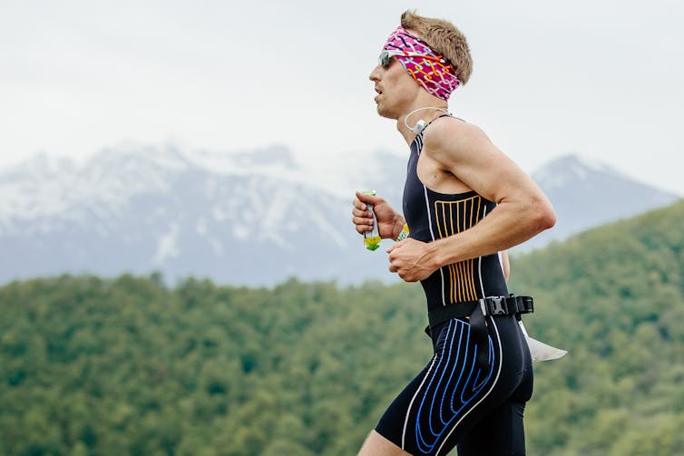 Runner consuming an energy gel