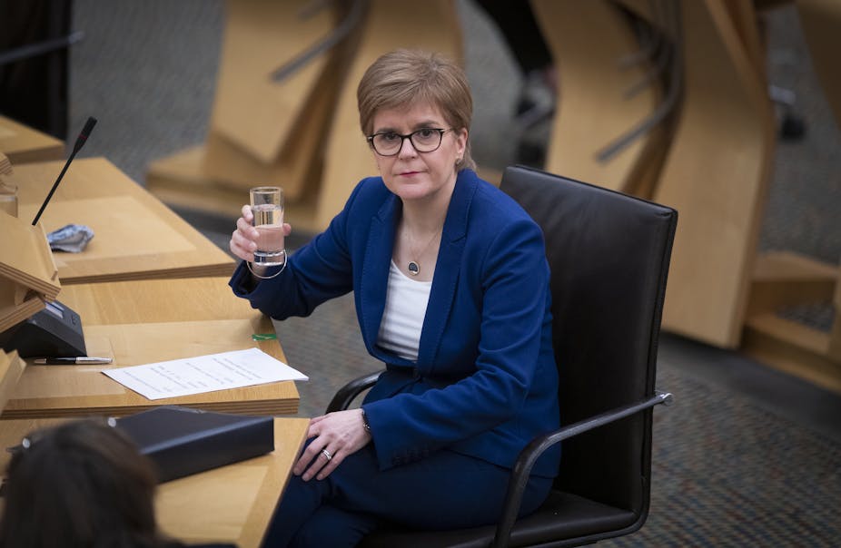 Nicola Sturgeon in Holyrood with a glass of water