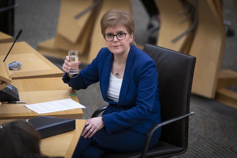Nicola Sturgeon in Holyrood with a glass of water