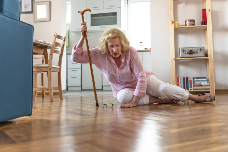 A woman who has fallen on her kitchen floor.
