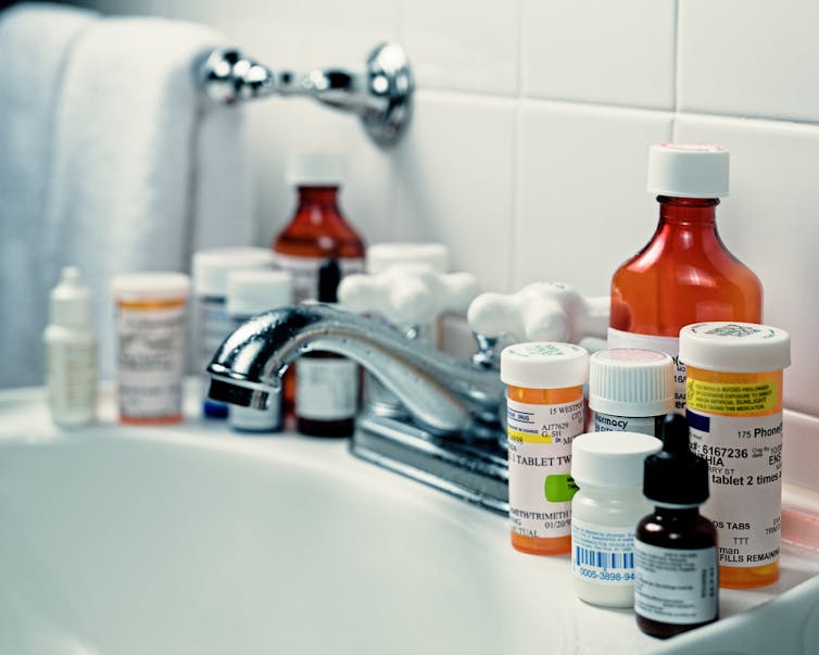 Many prescription medications around bathroom sink