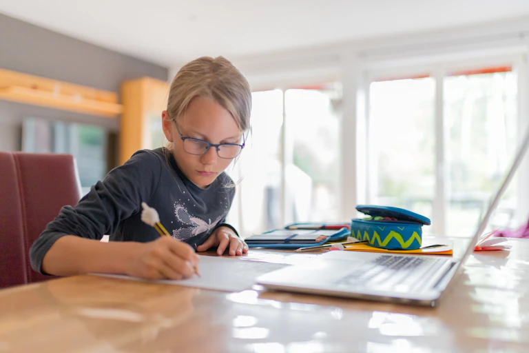 Girl learning at home.