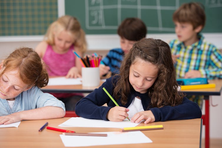 Primary school students sitting a test.