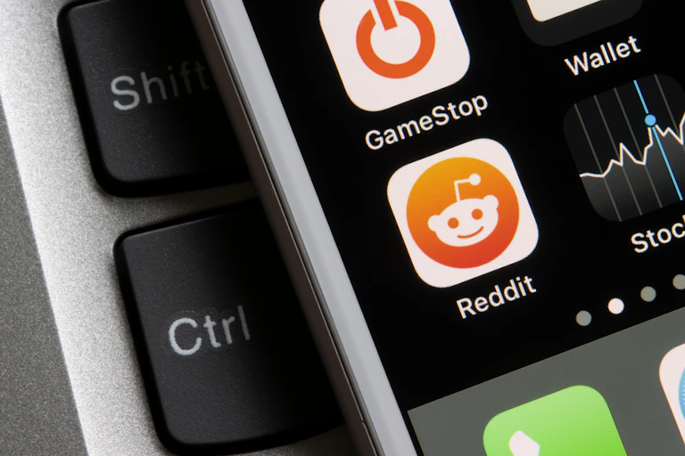 Smartphone with buttons for Reddit and GameStop