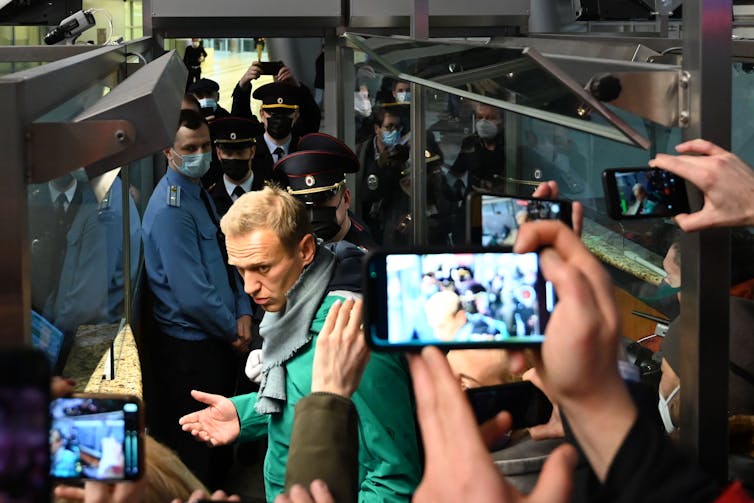 Navalny at passport control in Moscow on his return, just before he was arrested.