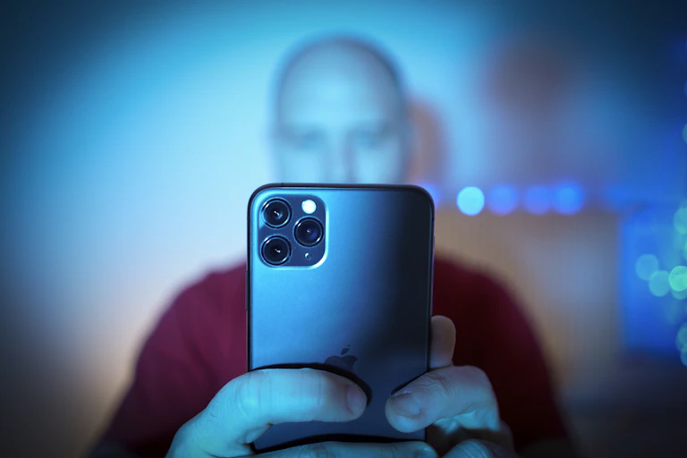 A man looking at his mobile phone.