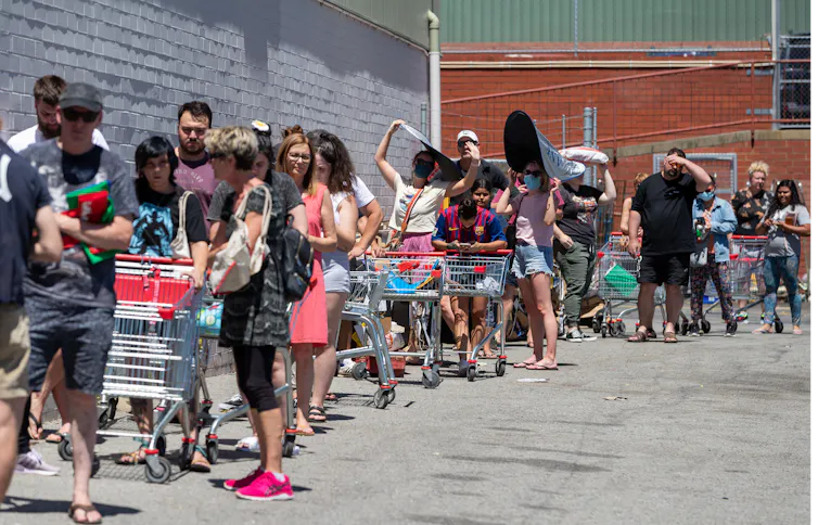 Shoppers queue outside a supermarket in Maylands, Perth