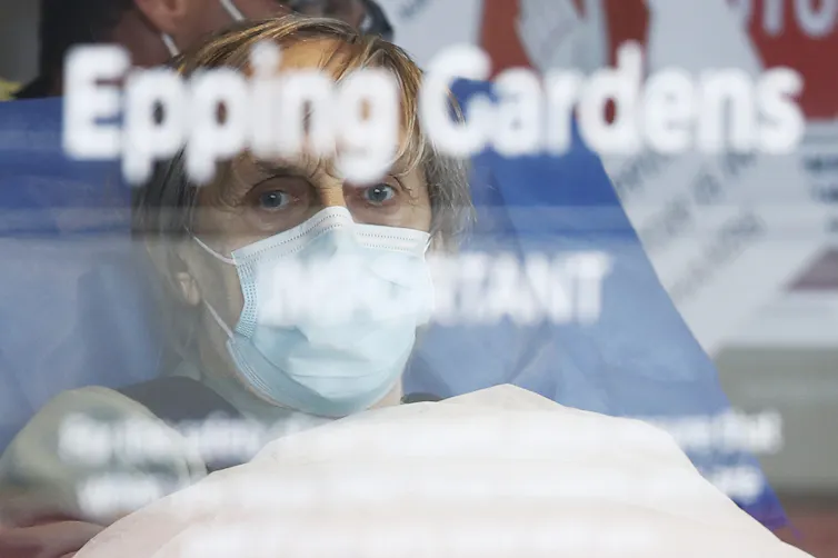 Aged Care resident taken away in an ambulance from Epping Gardens Aged Care Facility in Melbourne.