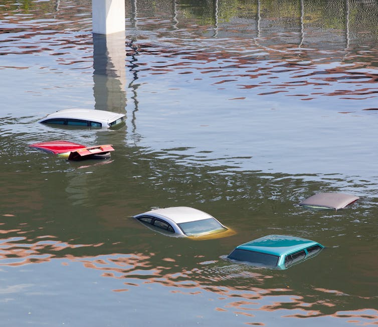 Rain inundates cars.