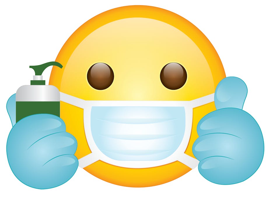 An emoji wearing a mask and surgical gloves, holding a bottle of hand sanitiser and giving the thumbs up