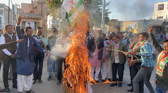 Indian farmer protesters burn effigy of Prime Minister Modi in the street