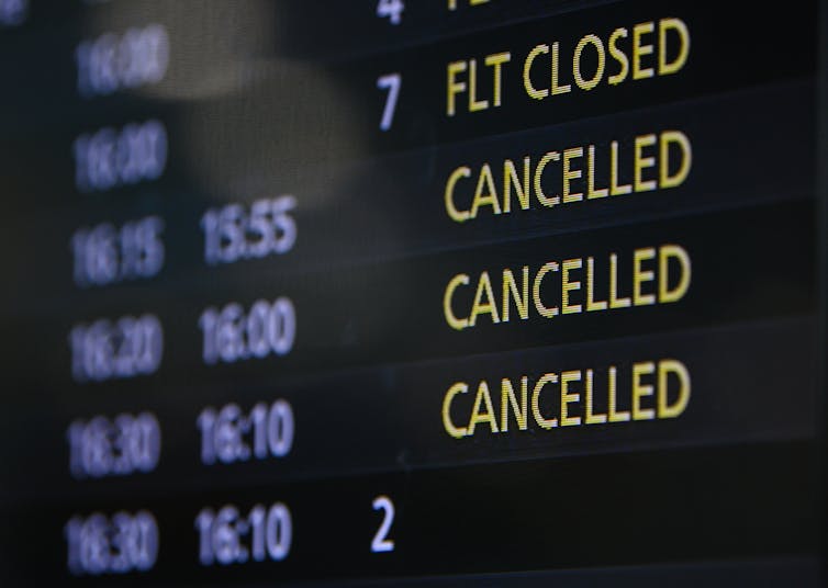Departures board showing cancelled flights.