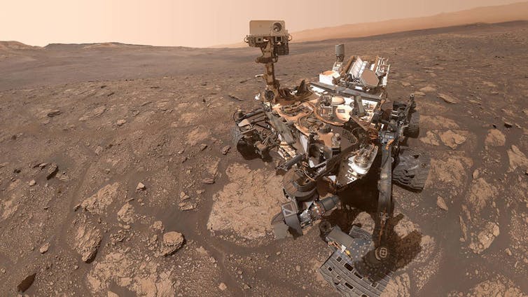The Curiosity rover on the Martian surface.