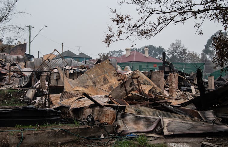 A house in ruins after being consumed by fire.