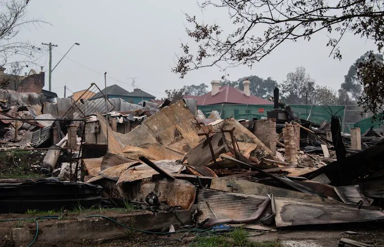 A house in ruins after being consumed by fire.