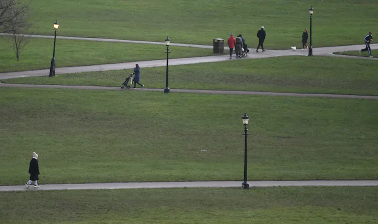 People walk in a park