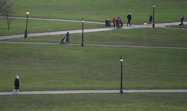 People walk in a park
