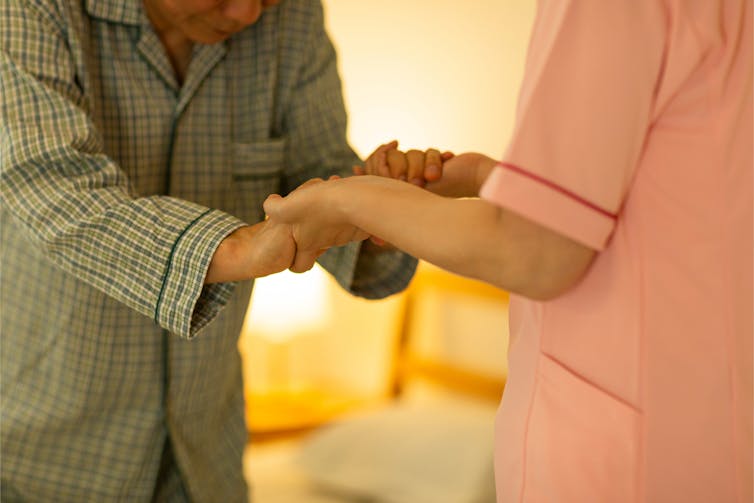 Aged care worker with elderly man.