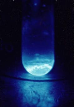A blue glowing vial of a chemical