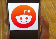 The Reddit logo on a mobile device.