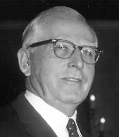 Headshot of a middle-aged white man wearing glasses.