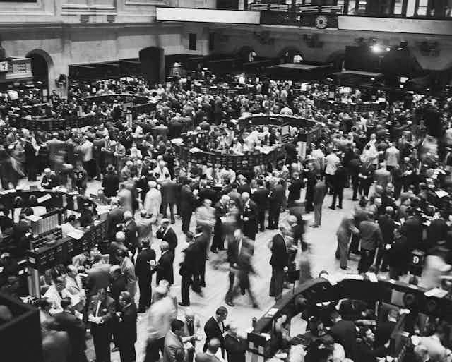 Crowds of traders on the New York Stock Exchange trading floor in 1955. 