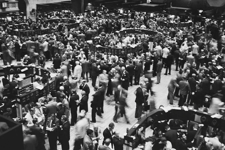 Crowds of traders on the New York Stock Exchange trading floor in 1955.