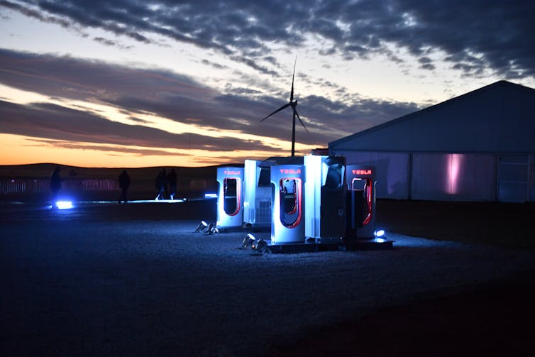 view of electric charging station at night