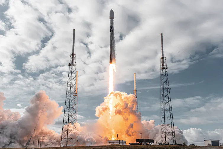 A SpaceX rocket being fired.