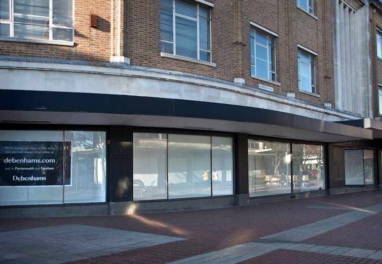 1930s department store front with covered windows