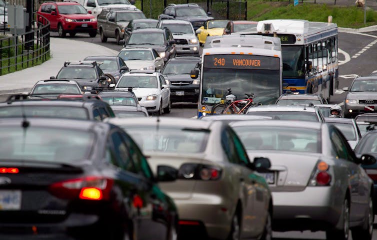 Motorists merge from four lanes into one as they enter the Lions Gate Bridge to drive into Vancouver.
