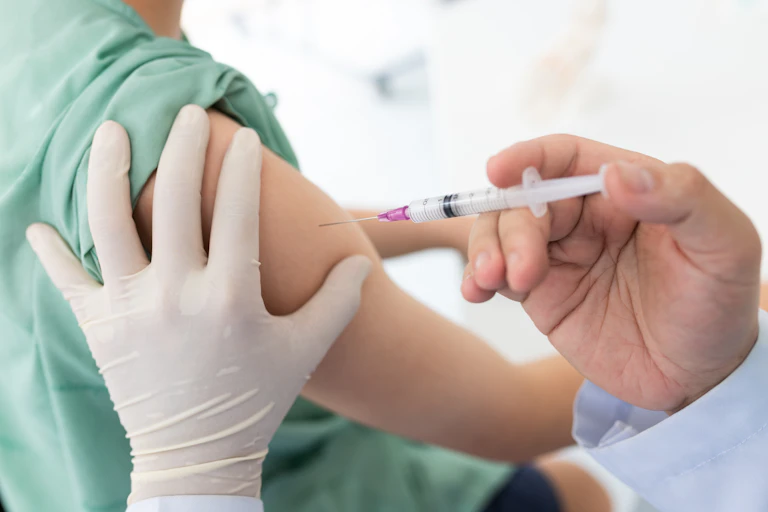 A patient receives an injection
