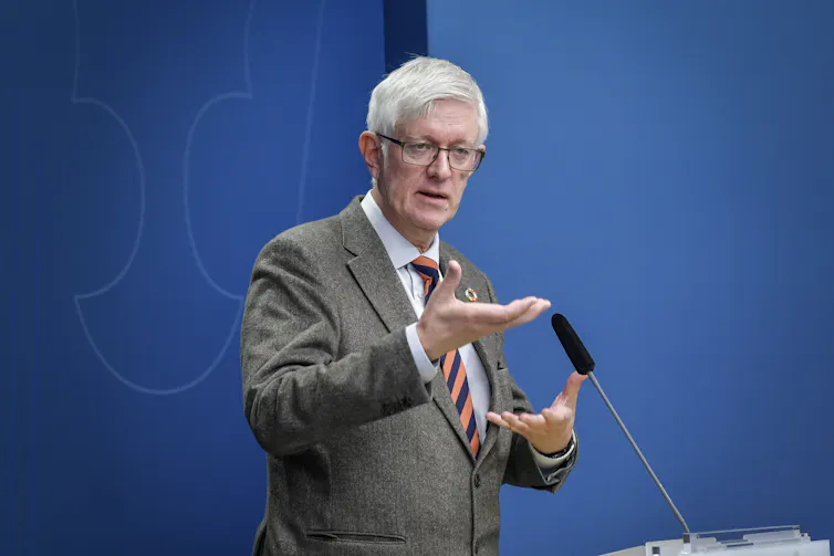 The head of Sweden's public health agency, Johan Carlsonm, giving a speech.