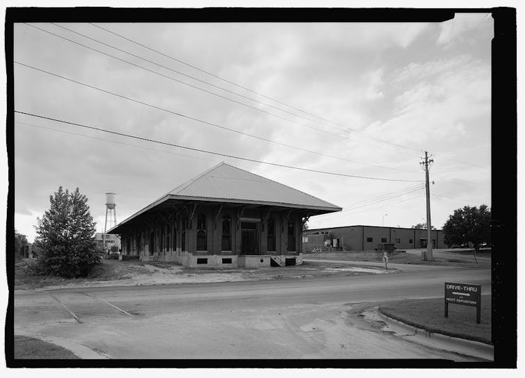 Black and white image of an old train depot