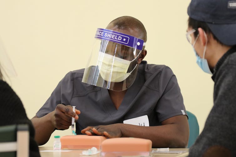 Students practice vaccination techniques