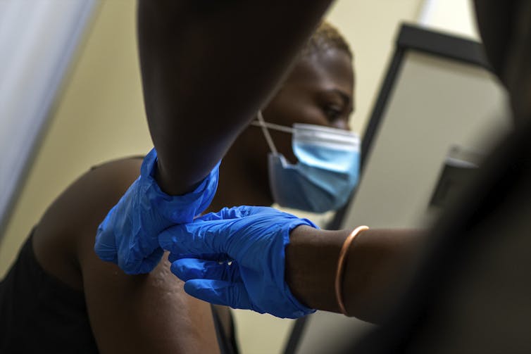 A person receives a dose of the AstraZeneca shot in South Africa.