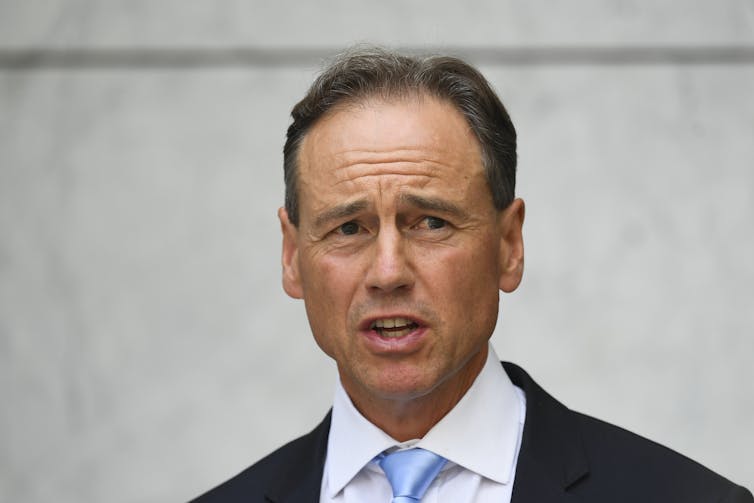 Australian health minister Greg Hunt speaks to the media.