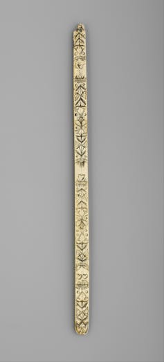 Intricately carved wooden strip from corset.