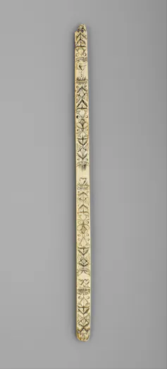 Intricately carved wooden strip from corset.