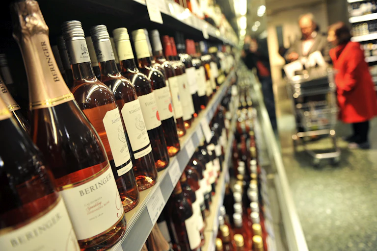Shop shelf with bottles of alcohol