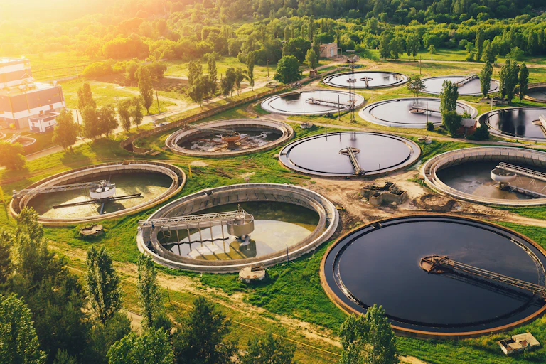 aerial view of sewage treatment plant at sunset