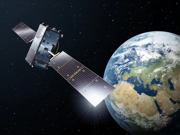 Galileo satellite in orbit, Earth in the background.