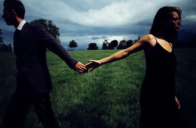 Two hands move apart.