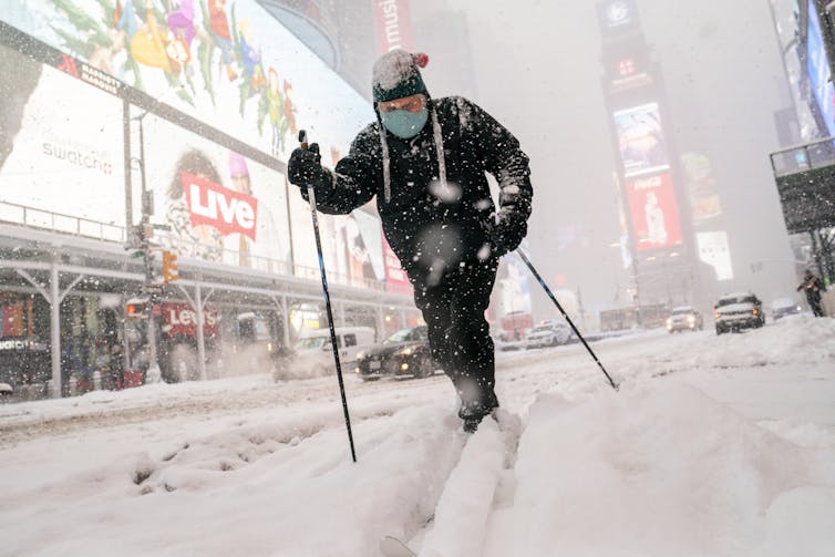 A man skies through Times Square in New York City.