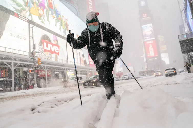 A man skies through Times Square in New York City.