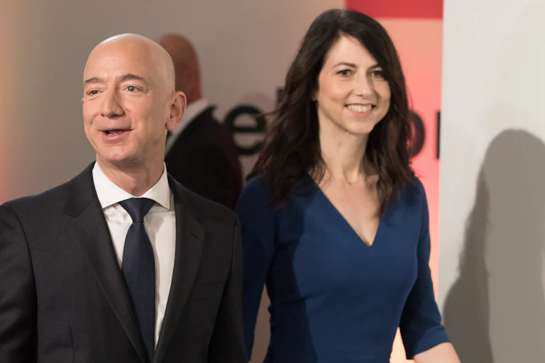 Jeff Bezos stands next to his ex-wife, MacKenzie Scott.and a tall woman.