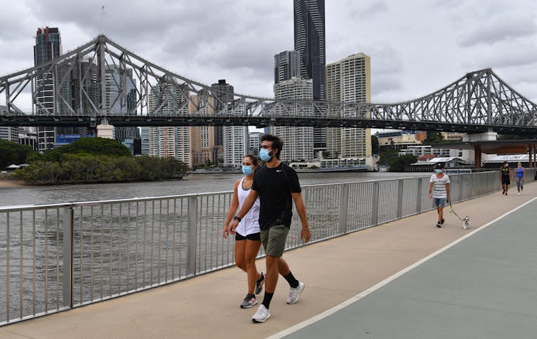 People walking in Brisbane wearing masks